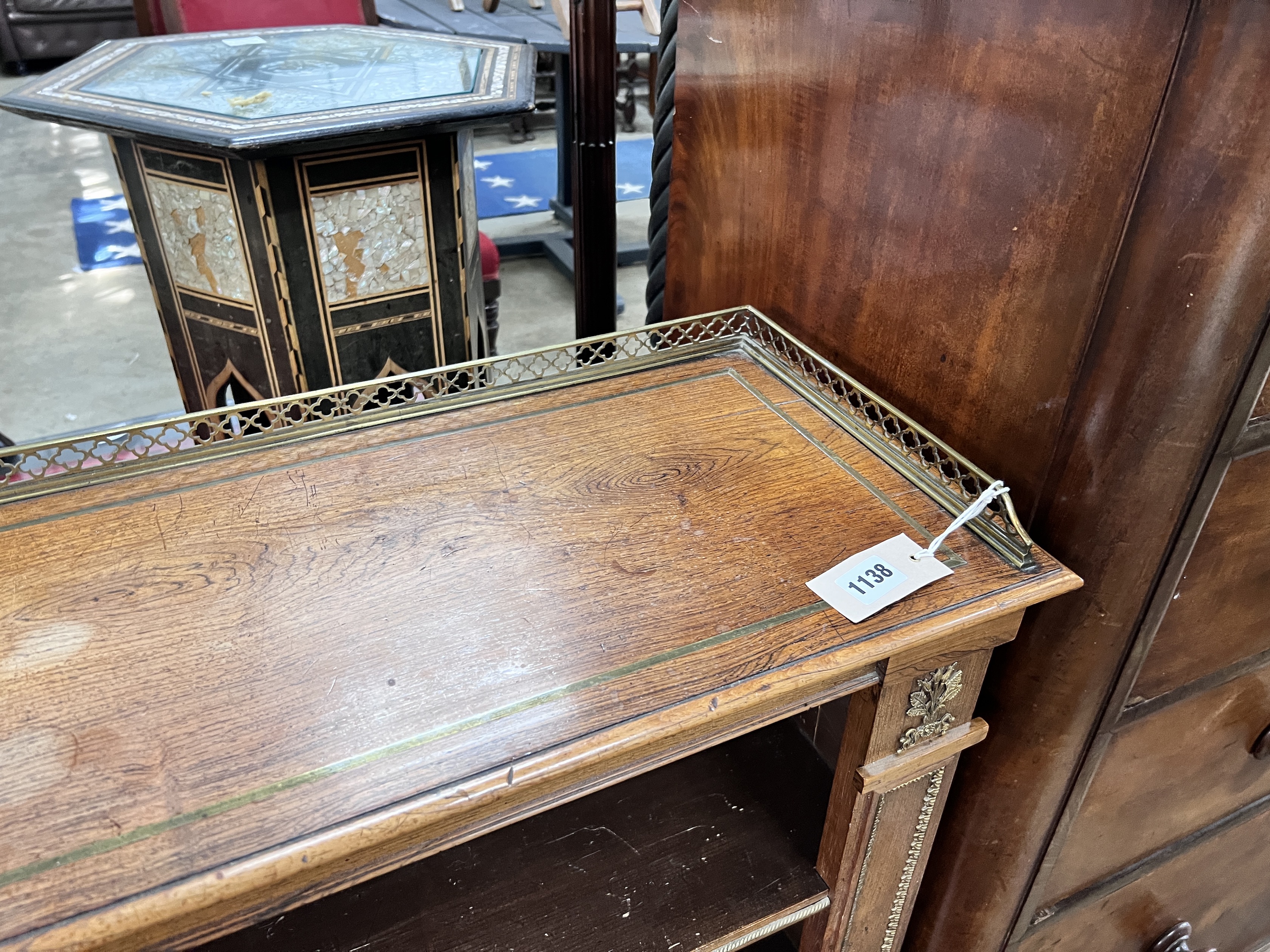 A Regency style giltwood metal mounted rosewood open bookcase, width 111cm, depth 30cm, height 90cm